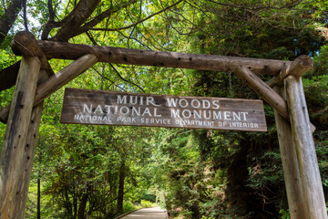the entrance sign of the Muir Woods national monument in california