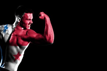 Panama flag handsome young muscular man black background