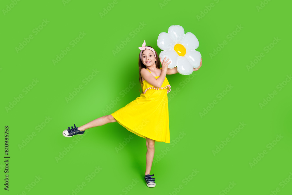 Sticker full length photo of adorable lovely small girl wear pin up dress rising inflatable daisy empty spac