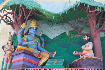 Vishnu talks with a brahmana. Indian religious sculpture.