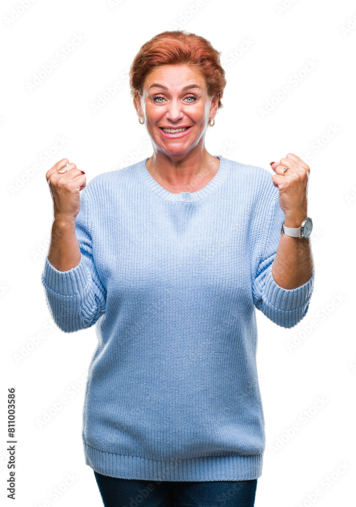 Sticker atrractive senior caucasian redhead woman over isolated background celebrating surprised and amazed 