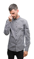 Fototapeta premium Young hipster man tired rubbing nose and eyes feeling fatigue and headache. Stress and frustration concept.