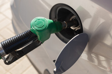 refueling Car fill with petrol gasoline at gas station, fuel cost