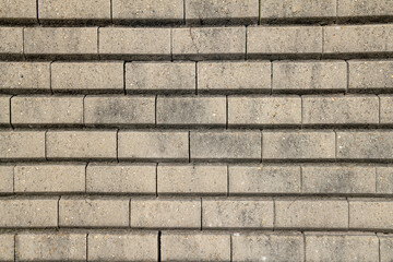 Fototapeta premium dry stone walls, construction detail of prefabricated walls in gravity concrete blocks, retaining wall in concrete blocks.