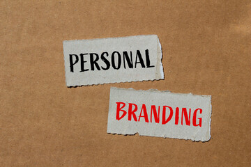 Personal branding words written on ripped paper pieces with brown background. Conceptual personal...
