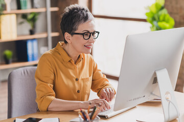 Photo of nice senior woman computer sit table dressed yellow formalwear executive business leader...