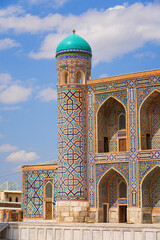 Corner turret of the Tilla-Kari (Tilya-Kori) Madrasah at the center of the Registan Square in Samarkand, Uzbekistan