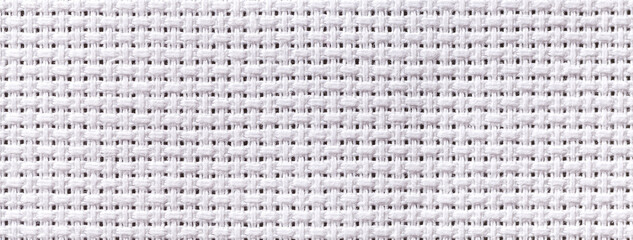 White textile background with checkered pattern, closeup. Structure of the fabric macro.