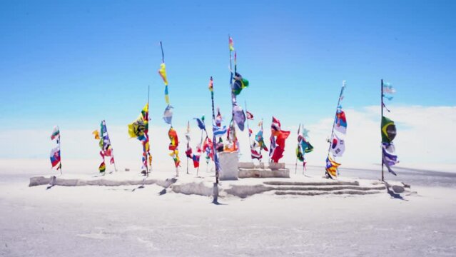 International flags at the Dakar monument on the Salar de Uyuni salt flats in Bolivia