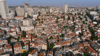 Jerusalem center city with red rooftops and tall buildings, drone view
Drone view from center of Jerusalem at noon, israel, 2022
