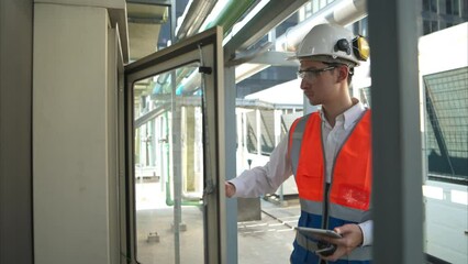 Before proceeding with the testing, Electrical engineer inspects the installed control panel.