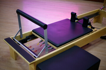 Reformer and box pilates stretcher. Equipment for Pilates classes. Wooden and leather pilates bed...