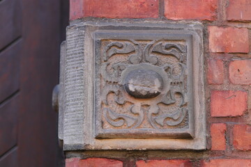 A stone decoratrion in the church wall