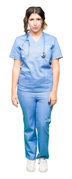 Young adult doctor woman wearing medical uniform depressed and worry for distress, crying angry and afraid. Sad expression.