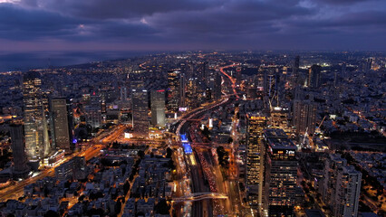 Fototapeta na wymiar Tel aviv city skyscarpes and traffic at night, Aerial Drone view from Tel aviv,June,26, 2023, 4K 