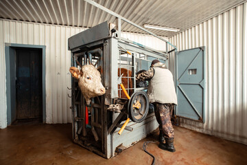 farmer operating complex machinery within a chute, illustrating the integration of engineering and...