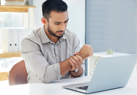 Laptop, pain and wrist for businessman at desk, carpal tunnel and overworked. Injury, joint problem and discomfort from hands in office, healthcare and inflammation or strain from nerve damage