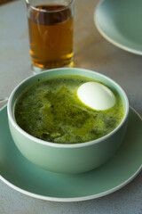 Photo of peruvian green soup. Concept of soups.