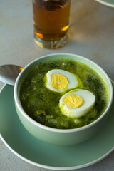 Photo of peruvian green soup. Concept of soups.