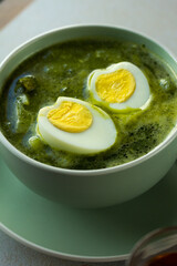 Photo of peruvian green soup. Concept of soups.