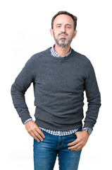 Handsome middle age senior man wearing a sweater over isolated background puffing cheeks with funny...