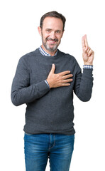 Handsome middle age senior man wearing a sweater over isolated background Swearing with hand on...