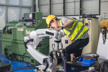 Trainees master robotics with hands-on workshops and quality control in manufacturing academy.