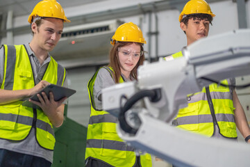 Trainees master robotics with hands-on workshops and quality control in manufacturing academy.