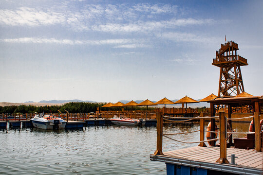 2013-08-22: wooden boats and coaks in the Xinjiang Ku'erle Lotus Lake Tourist Area in Xinjiang, China