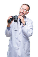 Middle age senior hoary doctor man looking through binoculars isolated background serious face thinking about question, very confused idea