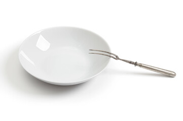 Empty plate with antique fork on a white background
