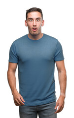 Obraz premium Handsome young casual man afraid and shocked with surprise expression, fear and excited face.