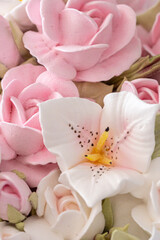 Zephyr bouquet of flowers in a wicker basket on a light background
