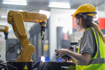 Trainees master robotics with hands-on workshops and quality control in manufacturing academy.