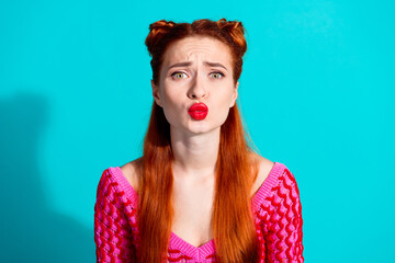 Photo of impressed funky lady dressed pink knitted shirt sending you kiss isolated blue color...