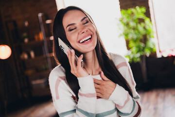 Photo of lovely young woman talk phone chatting laughing wear striped outfit interior home living...