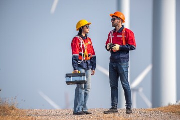 couple engineer team inspection check control wind power machine construction installation in wind energy factory. Two technician professional worker discussion for maintenance wind power turbine