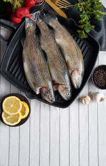 Fresh Trout in a Pan on the Table
