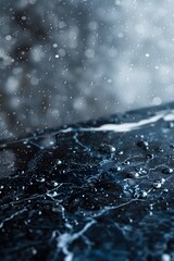 Marble top with rain falling on the ground, blurred background, empty space for product presentation mock up 
