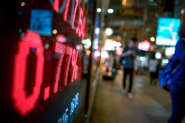 City Nightlife with Bright Red Digital Stock Ticker
