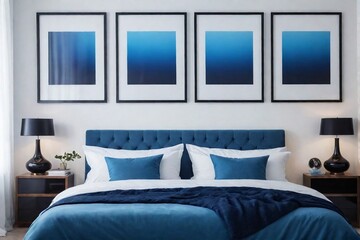 Blue modern bedroom with double bed, pillows, and two bedside cabinets against white wall with poster frames.