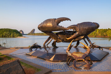The Mud Crabs Sculpture by a scenic river landscape in Krabi Town, Thailand on a sunny day. Khao...