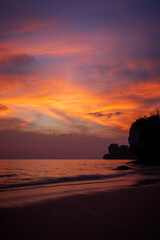 Beautiful landscape of sea, beach and colorful sky during sunset at the Railay West Beach in Railay, Krabi, Thailand.