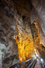 Walkway inside the scenic, illuminated and narrow Diamond Cave (Tham Phra Nang Nai) in Railay,...