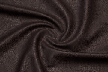brown artificial leather with waves and folds on PVC base