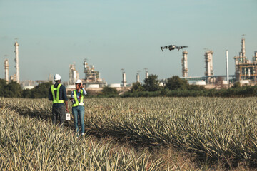 Engineer surveyor team Use drone for operator inspecting and survey construction site. Surveyors or...