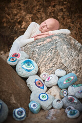 Young hairless girl with alopecia in white futuristic costume sleeping sweetly in surreal landscape...