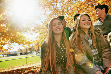 Smile, teenagers and friends outdoor in park for relaxing day on summer vacation of semester break,...