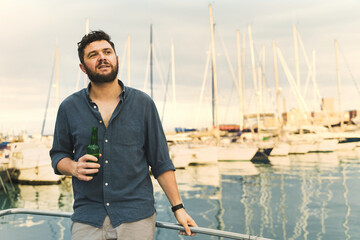 Casual Man Enjoying Beer at Marina