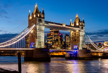 Tower bridge with City of London skyscrapers at sunset, UK